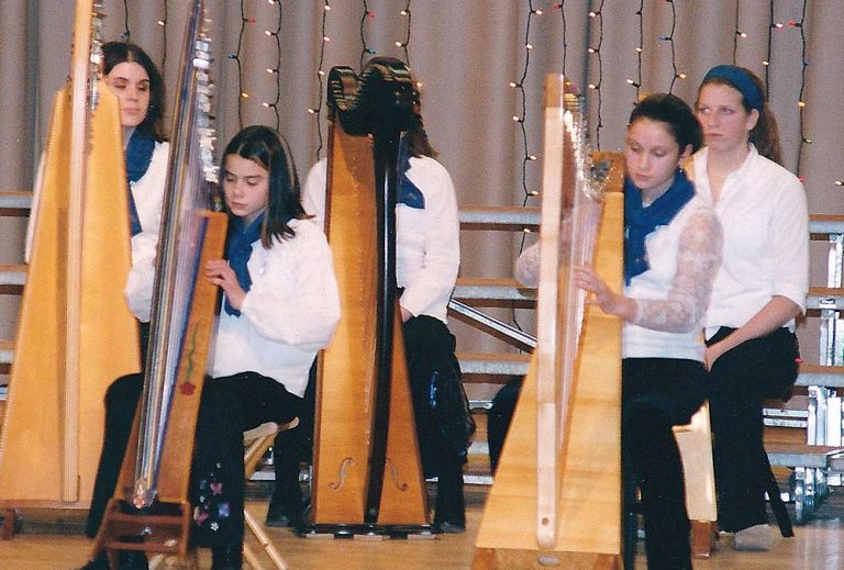 Five student members of the Ottawa Youth Harp Ensemble playing at Centrepointe